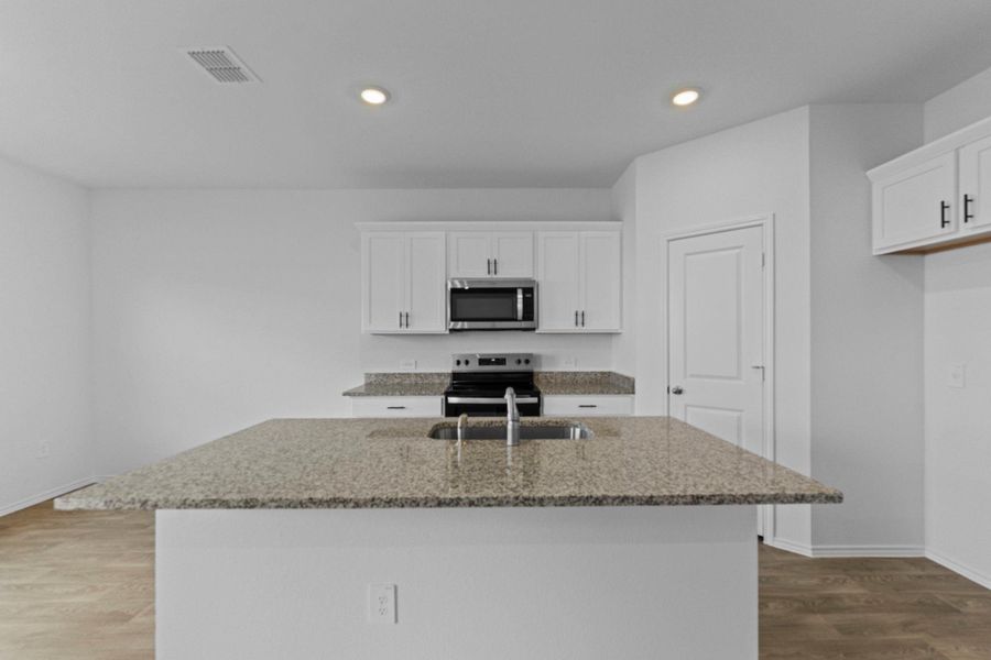 Furnished interior view inside a new home in Palomino, Manor (Image 6). Furnished interior view inside a new home in Palomino, Manor (Image 6).