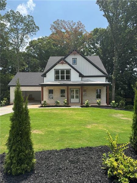 Front exterior of a new home in , Buford, GA, highlighting curb appeal (Image 1). Front exterior of a new home in , Buford, GA, highlighting curb appeal (Image 1).