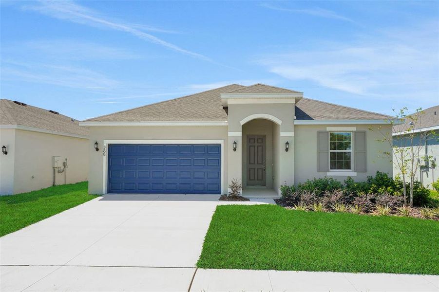 Front exterior of a new home in Willowbrook North, Winter Haven, FL, highlighting curb appeal (Image 20).