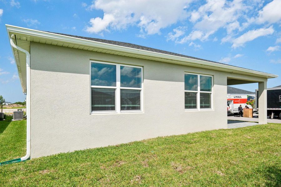 Exterior details and patio area of a home in Brystol at Wylder - Reserve Series, Port St. Lucie (Image 23). Exterior details and patio area of a home in Brystol at Wylder - Reserve Series, Port St. Lucie (Image 23).