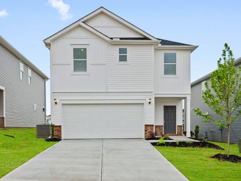 Front exterior of a new home in Brayfield Manor - Heritage Collection, Wellford, SC, highlighting curb appeal (Image 1).
