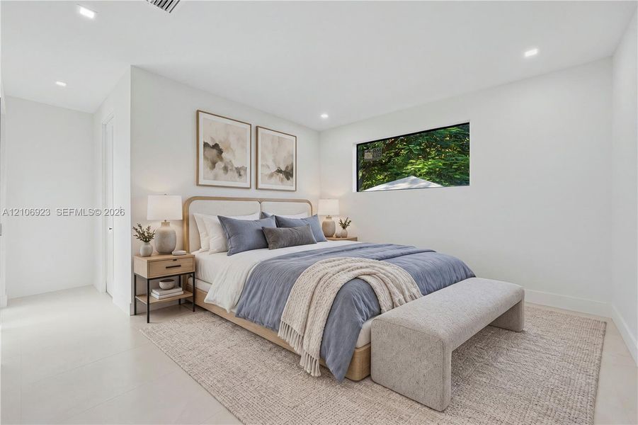 Neutral-toned interior featuring recessed ceiling lighting, light-colored tile flooring, and a horizontal rectangular window Neutral-toned interior featuring recessed ceiling lighting, light-colored tile flooring, and a horizontal rectangular window