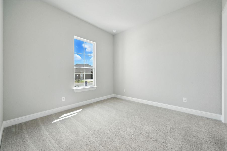Unfurnished room featuring carpet floors and baseboards