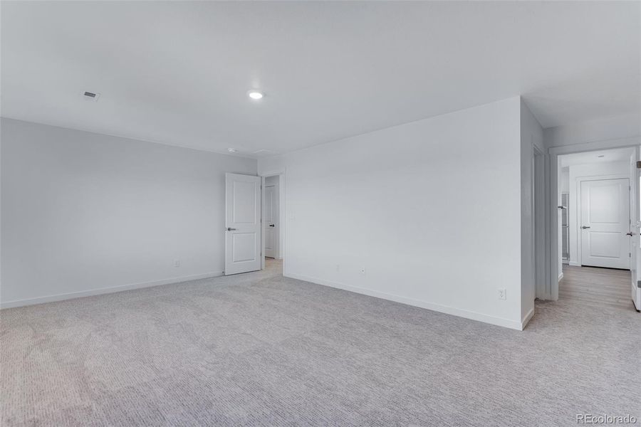 Spacious, unfurnished interior of a new home in Trails at Crowfoot, Parker (Image 27).