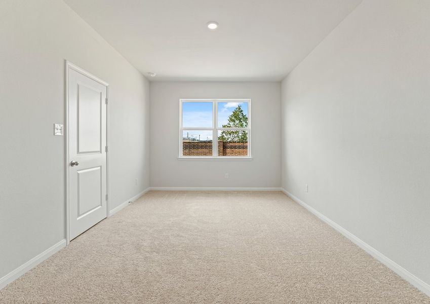 Master bedroom with a walk-in closet and bathroom