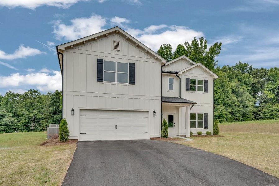 Front exterior of a new home in , Newborn, GA, highlighting curb appeal (Image 2). Front exterior of a new home in , Newborn, GA, highlighting curb appeal (Image 2).