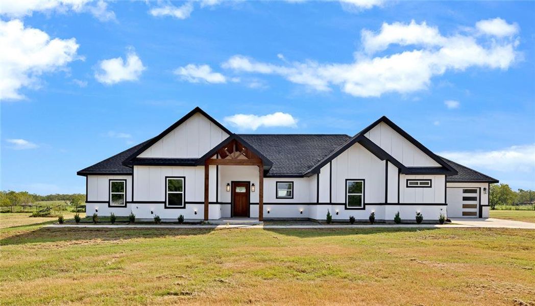 Front exterior of a new home in , Kaufman, TX, highlighting curb appeal (Image 22). Front exterior of a new home in , Kaufman, TX, highlighting curb appeal (Image 22).