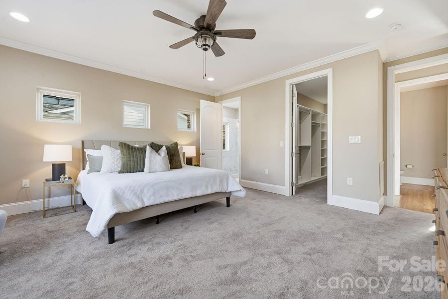 Primary suite entry showcasing the spacious layout and direct access to the spa-inspired bath. Primary suite entry showcasing the spacious layout and direct access to the spa-inspired bath.