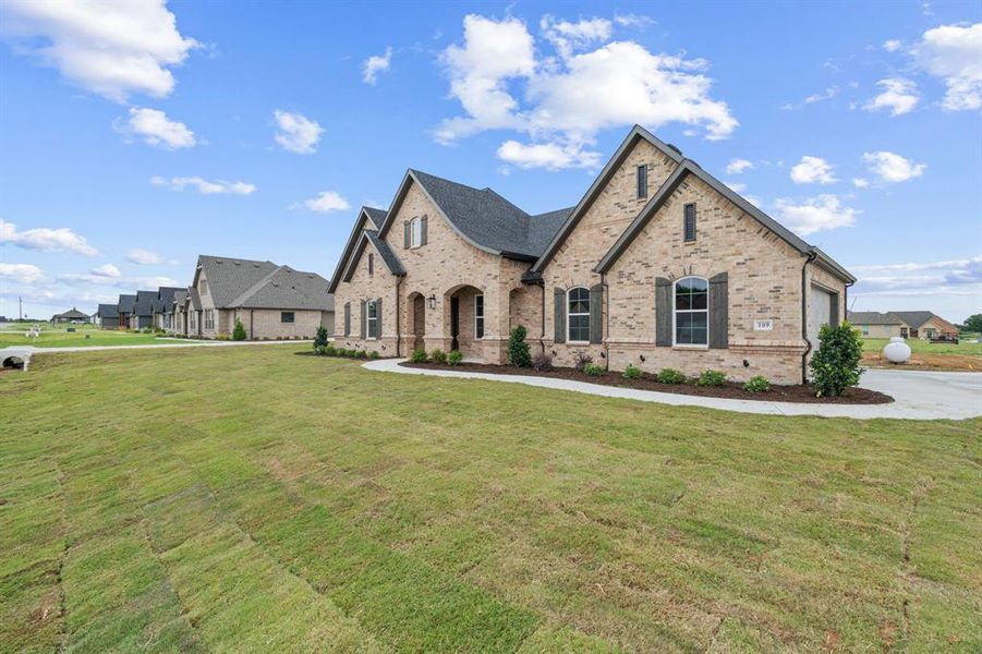 Front exterior of a new home in , Paradise, TX, highlighting curb appeal (Image 2).