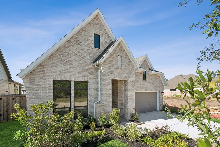 Front exterior of a new home in Kresston, Magnolia, TX, highlighting curb appeal (Image 24).