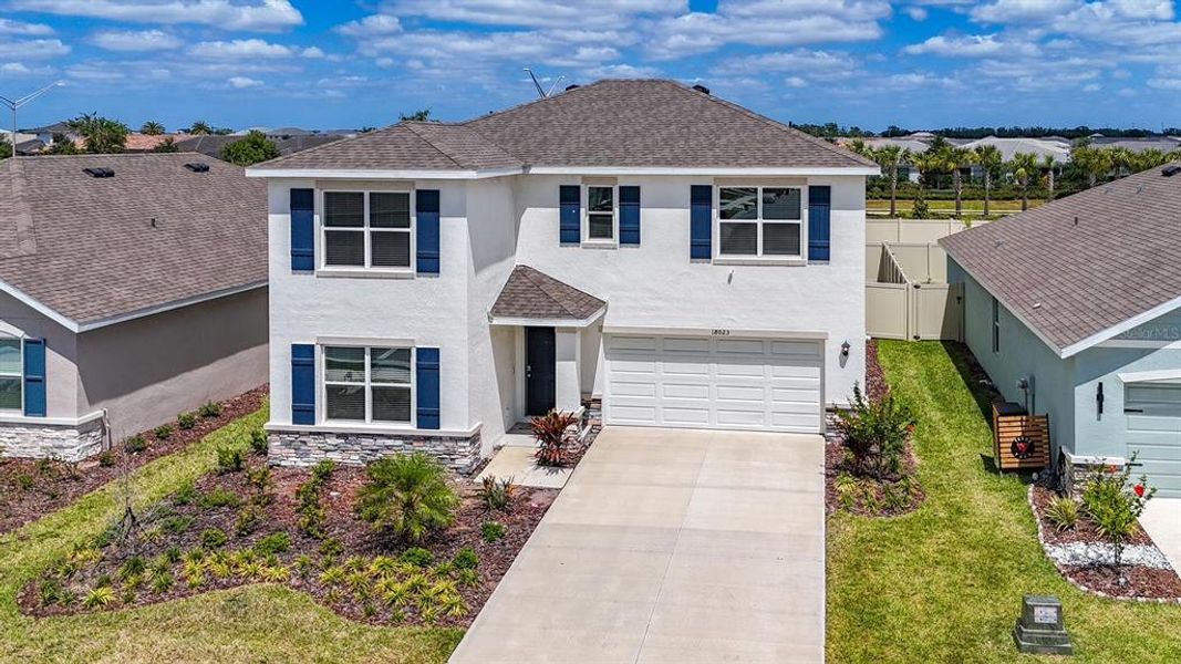 Front exterior of a new home in Solera at Lakewood Ranch, Bradenton, FL, highlighting curb appeal (Image 10).
