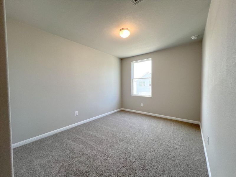 Spare room with baseboards and carpet floors Spare room with baseboards and carpet floors