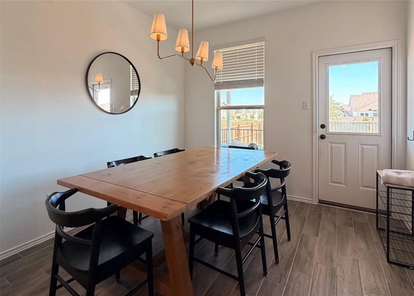 Dining space with wood finish floors Dining space with wood finish floors