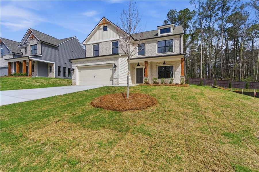 Front exterior of a new home in The Overlook at Factory Shoals, Mableton, GA, highlighting curb appeal (Image 22).
