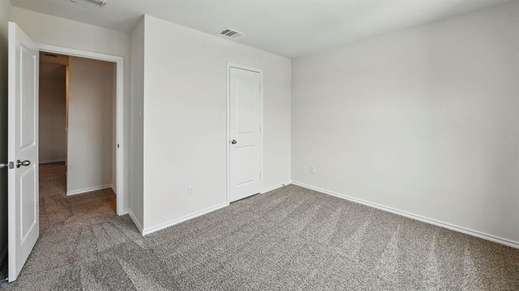 Unfurnished bedroom featuring carpet flooring