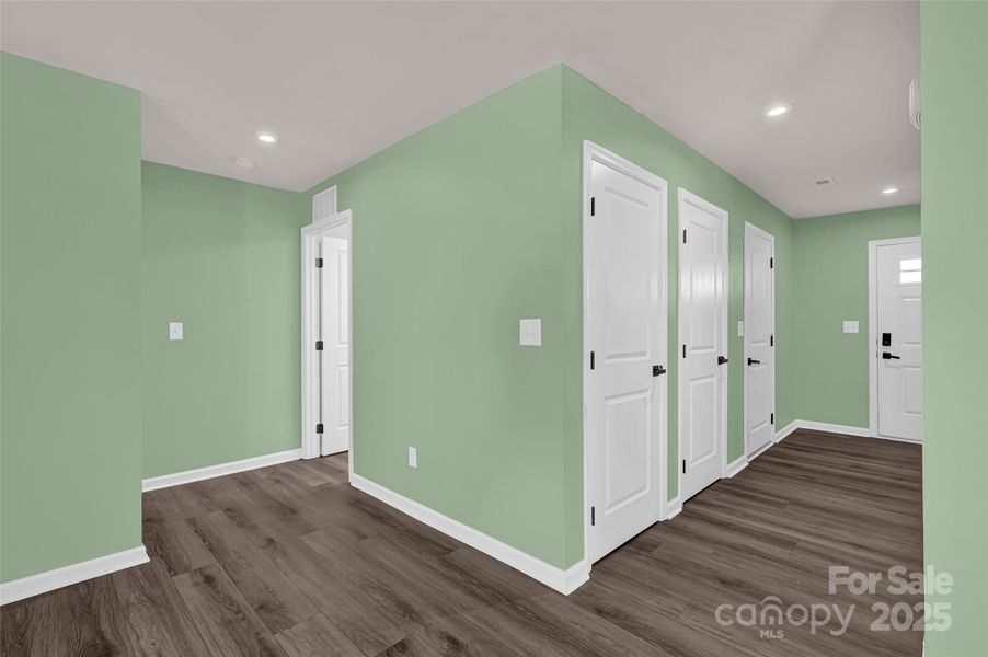 Hallway to family area, kitchen, and primary suite