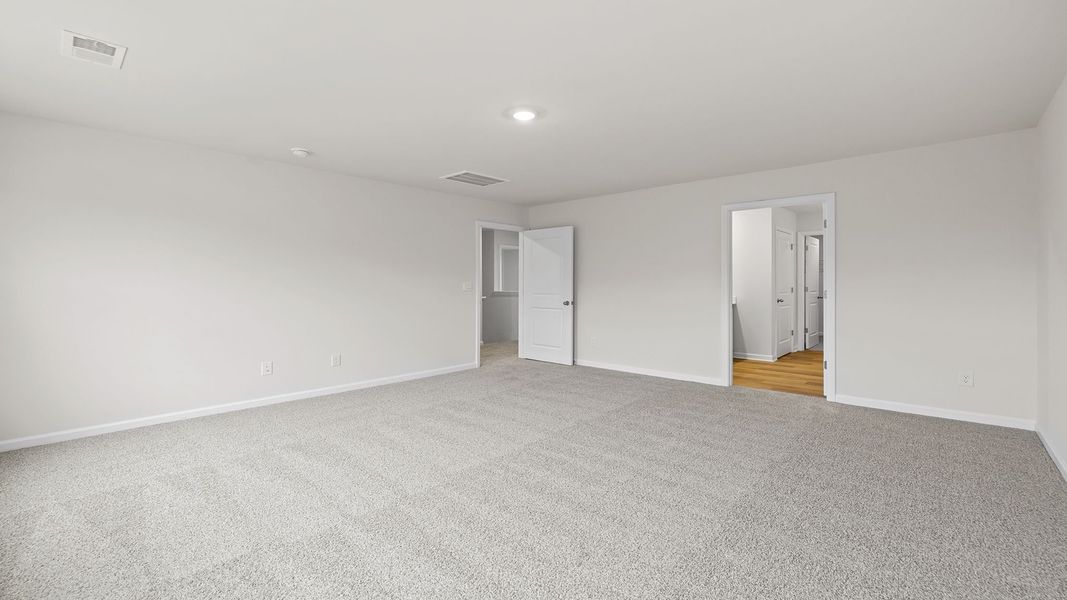 Spacious, unfurnished interior of a new home in Bentley Park, Greenwood (Image 27).