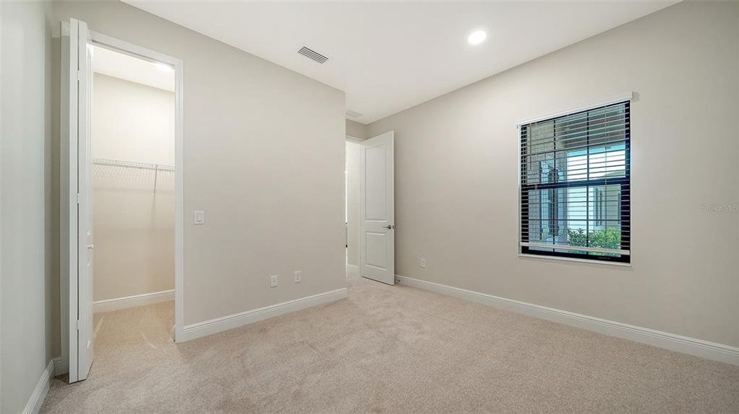 Spacious, unfurnished interior of a new home in Vicenza Real Estate and Homes for Sale in North Venice, FL - Neal Communities, Nokomis (Image 32).