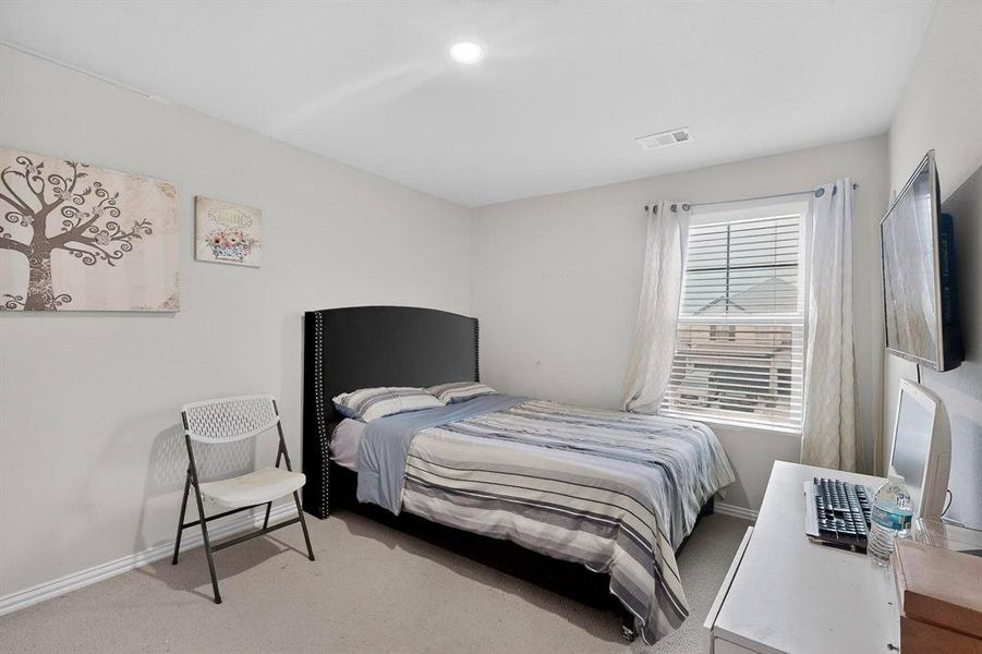 Carpeted bedroom featuring baseboards Carpeted bedroom featuring baseboards