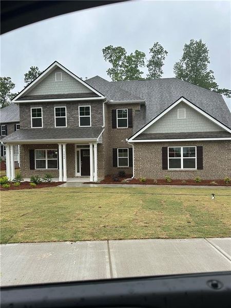 Front exterior of a new home in Mirror Lake at South Harbour, Villa Rica, GA, highlighting curb appeal (Image 25).