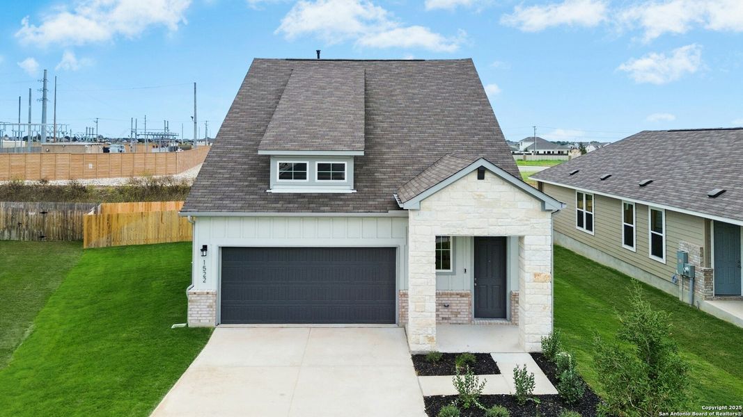 Front exterior of a new home in Willowbrook, New Braunfels, TX, highlighting curb appeal (Image 1).