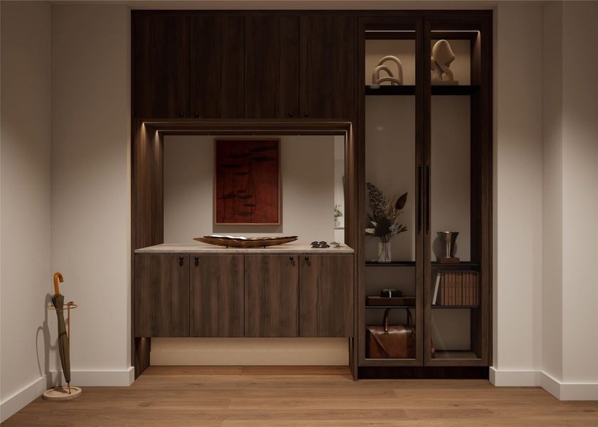 Entry feature with built-in cabinetry and quartzite countertop in the Trailhead palette. Designed to provide elegant storage and a cohesive introduction to the home’s interior finishes.