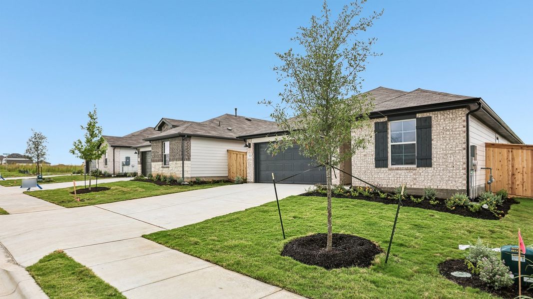 Front exterior of a new home in Briarwood, Elgin, TX, highlighting curb appeal (Image 21).