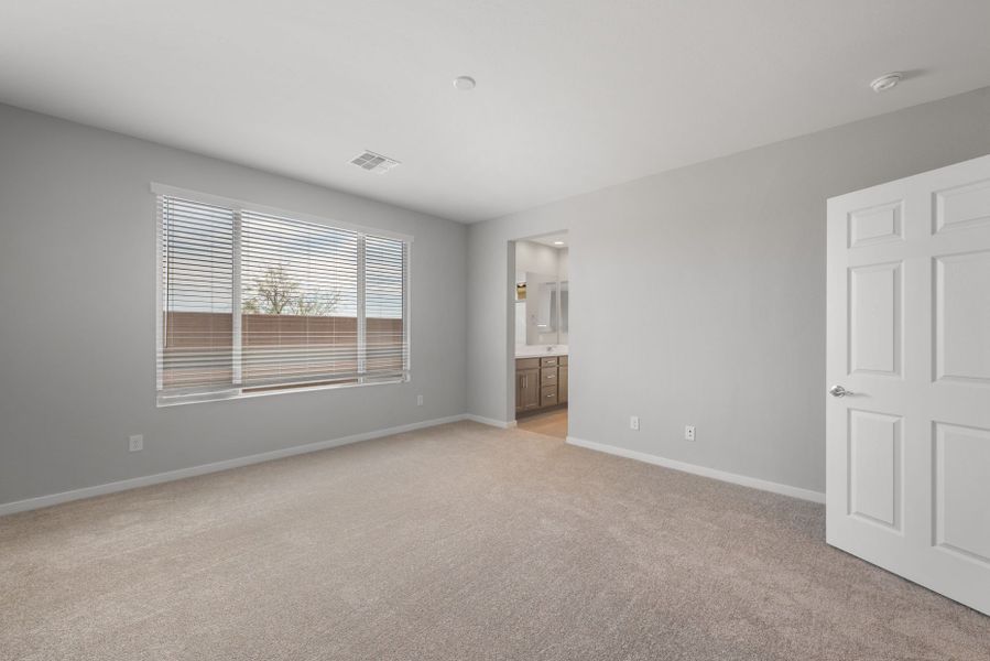 Spacious, unfurnished interior of a new home in Blossom Rock, Apache Junction (Image 22).
