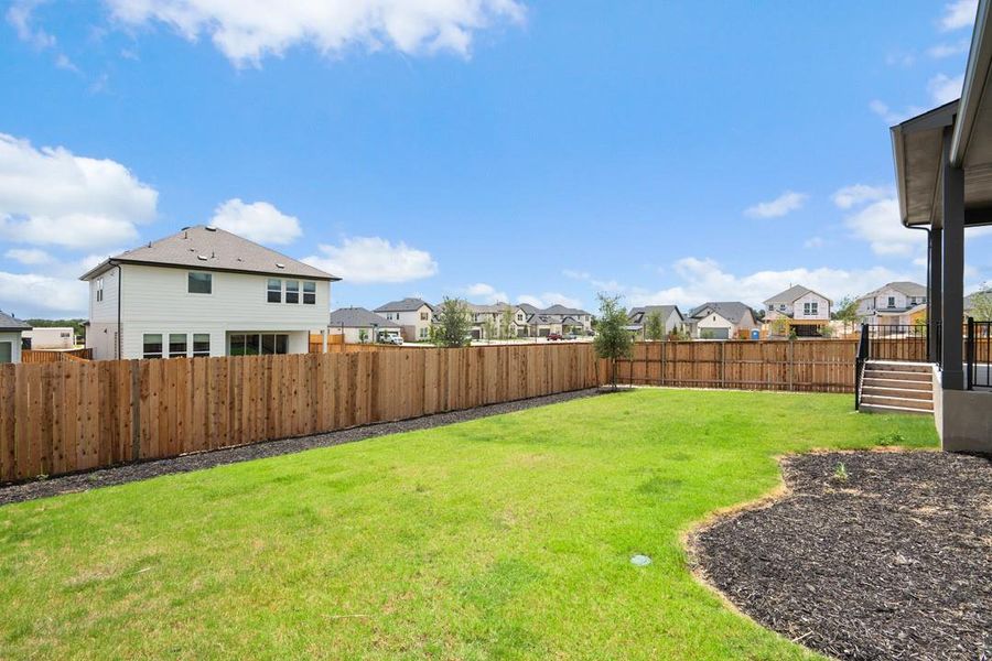 Front exterior of a new home in Park Collection at Heritage, Dripping Springs, TX, highlighting curb appeal (Image 22). Front exterior of a new home in Park Collection at Heritage, Dripping Springs, TX, highlighting curb appeal (Image 22).