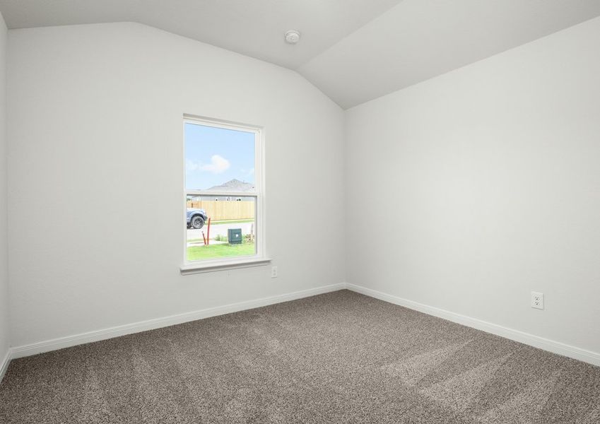 The secondary bedroom is a great space for a child's bedroom or a guest room.