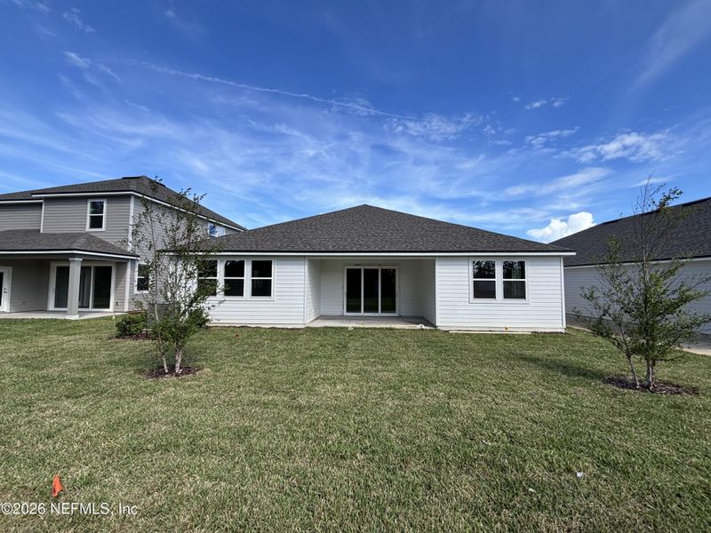 Exterior details and patio area of a home in The Cypress Series at Reserve East, Flagler Beach (Image 18).