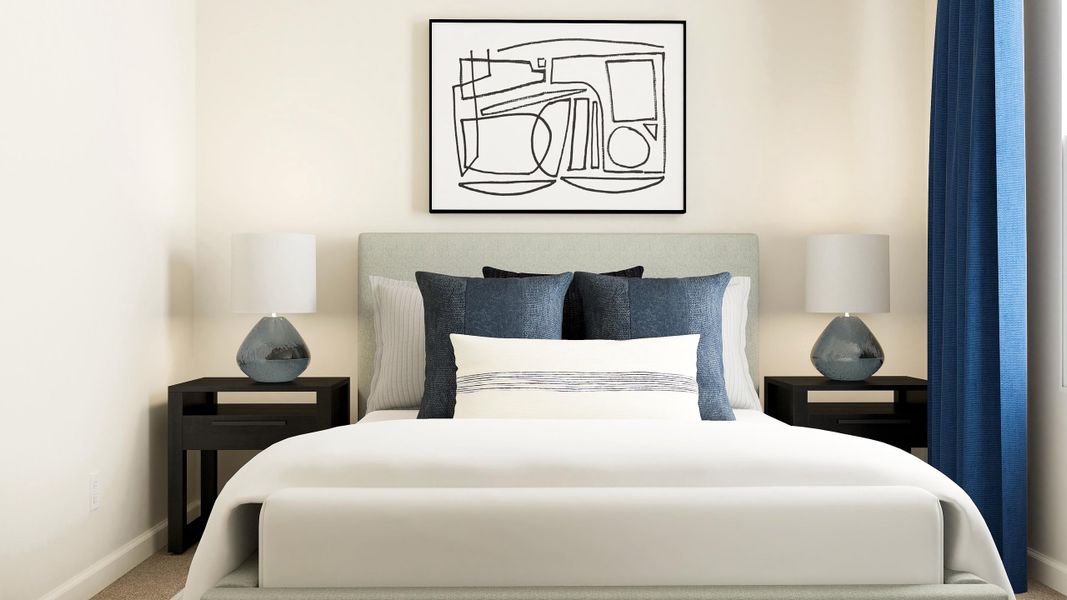 A bed with a white bed spread.