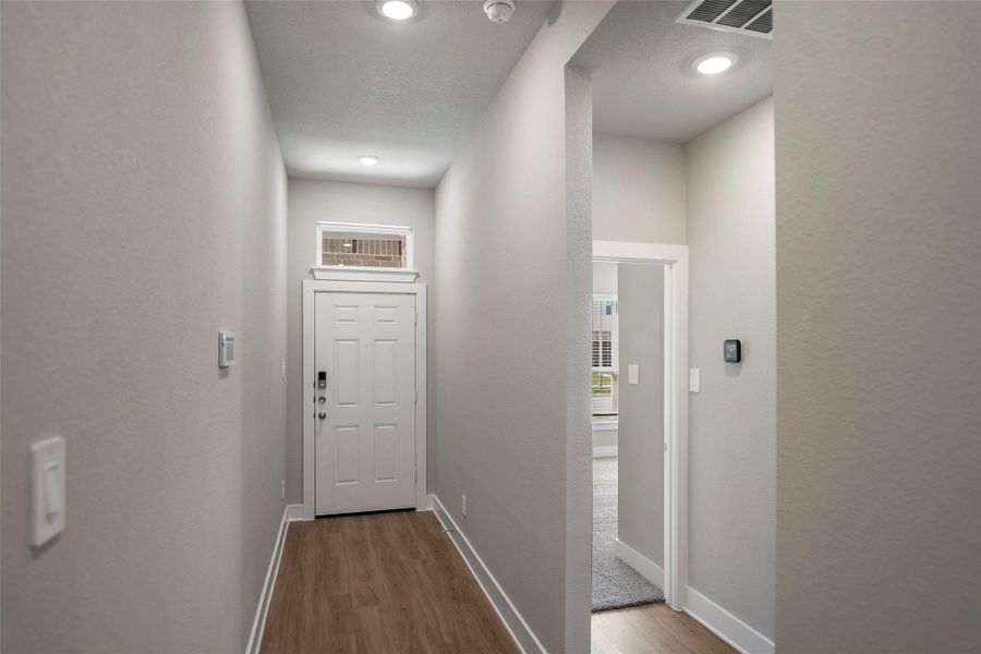Inviting entryway and modern architectural touches create a warm welcome for guests.