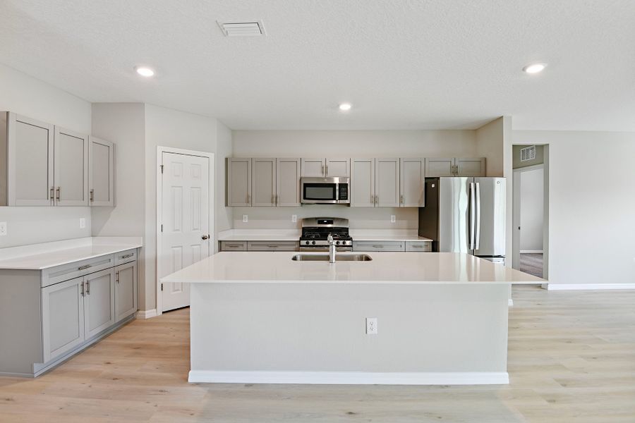 Furnished interior view inside a new home in Pasadena Ridge, Dade City (Image 6).