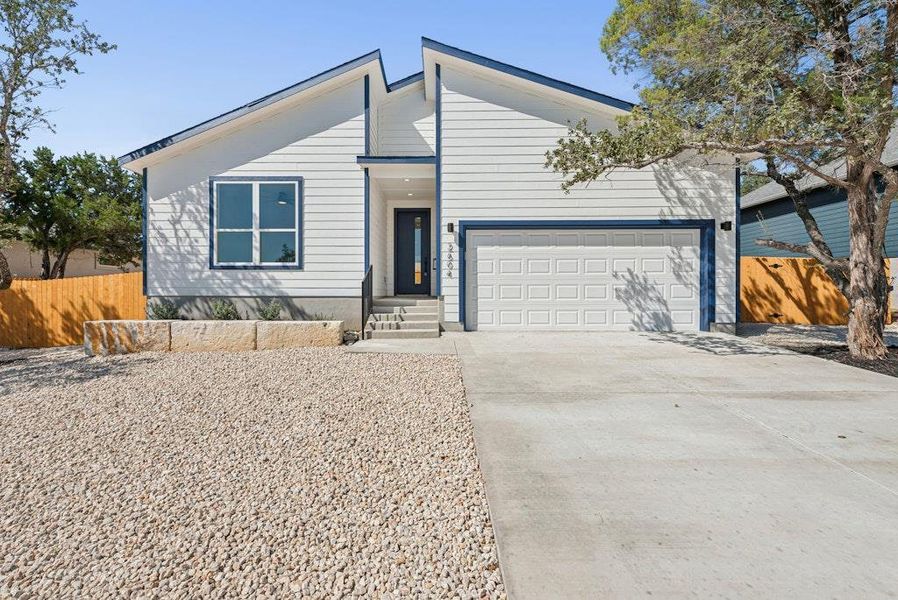 Front exterior of a new home in , Lago Vista, TX, highlighting curb appeal (Image 1). Front exterior of a new home in , Lago Vista, TX, highlighting curb appeal (Image 1).