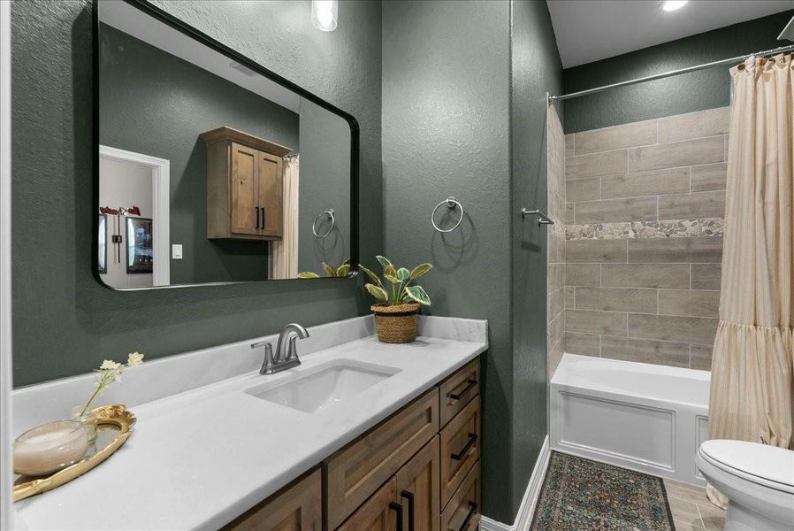 Guest bathroom connected to bedroom #2 and hallway.