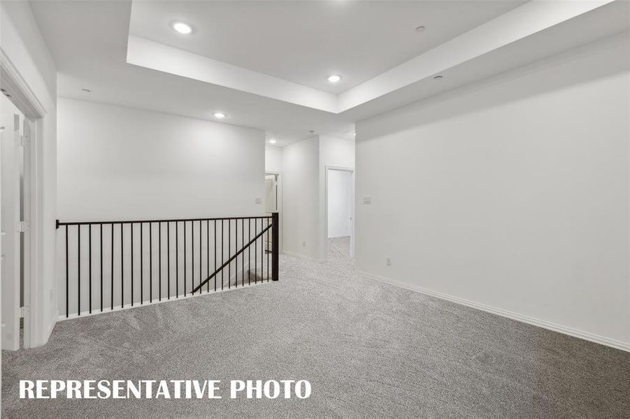 Your new upstairs entertainment area features a spacious game room paired with a wonderful media room! REPRESENTATIVE PHOTO Your new upstairs entertainment area features a spacious game room paired with a wonderful media room! REPRESENTATIVE PHOTO