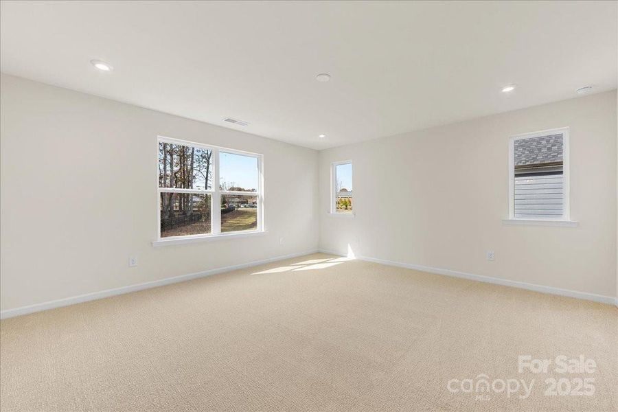 Primary Suite Bathed in Light and Unobstructed Tree-Lined Views.