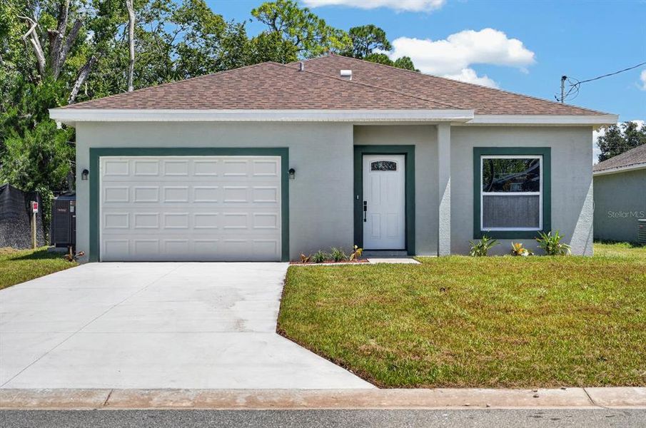 Front exterior of a new home in , Daytona Beach, FL, highlighting curb appeal (Image 20). Front exterior of a new home in , Daytona Beach, FL, highlighting curb appeal (Image 20).