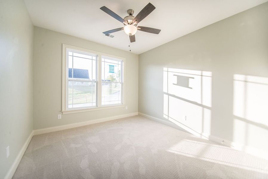 Representative unfurnished interior of a home built from the Mediterranean by Enchanted Homes in Messer Farms, Inman (Image 22).