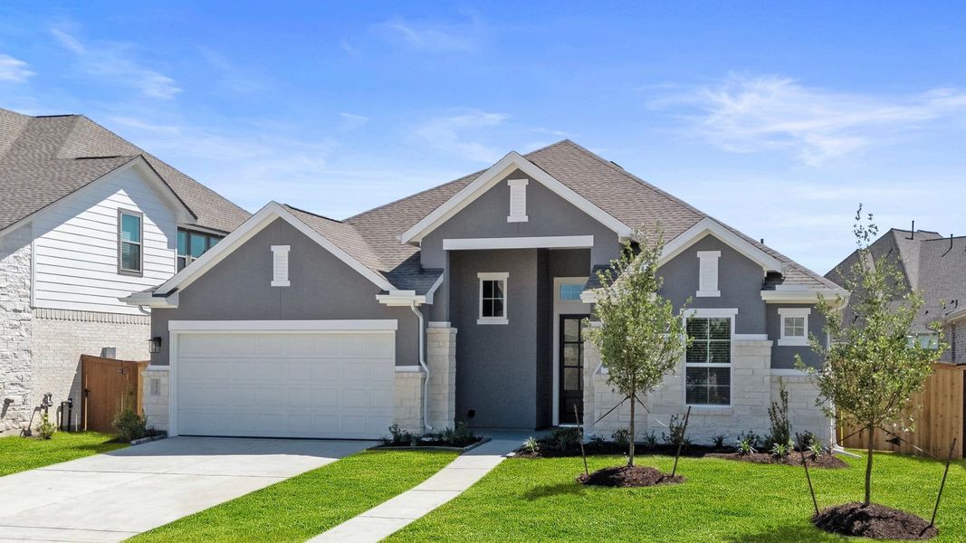 Front exterior of a new home in Jordan Ranch, Fulshear, TX, highlighting curb appeal (Image 19). Front exterior of a new home in Jordan Ranch, Fulshear, TX, highlighting curb appeal (Image 19).