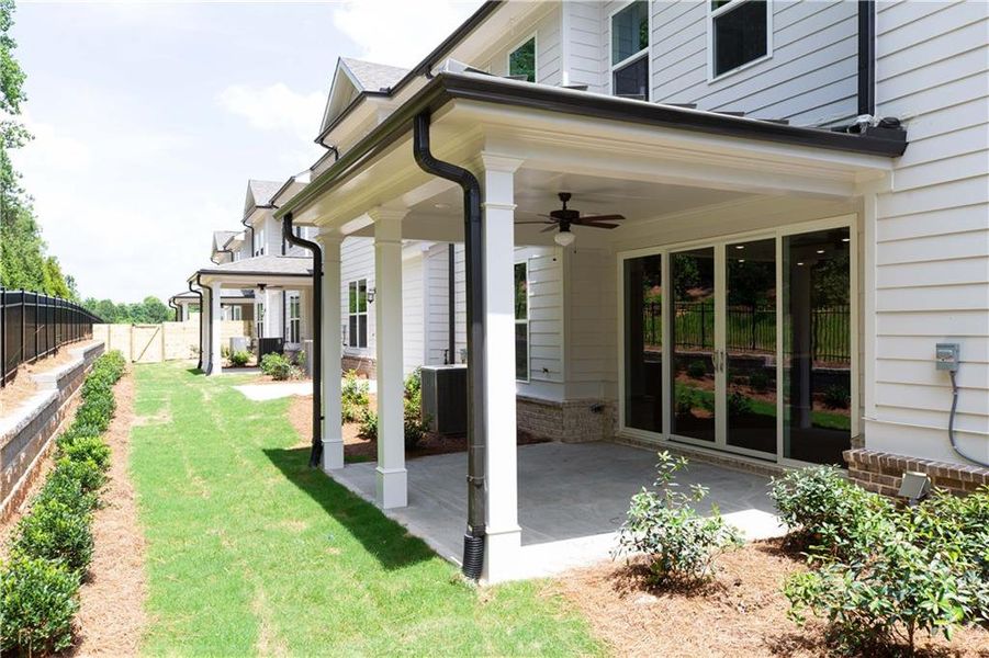 Exterior details and patio area of a home in Millcroft Townhomes, Buford (Image 25).