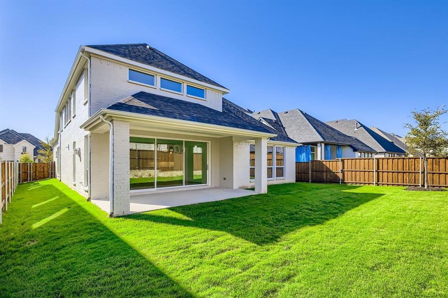 Rear view of property featuring brick siding, a patio area, a fenced backyard, and a shingled roof Rear view of property featuring brick siding, a patio area, a fenced backyard, and a shingled roof