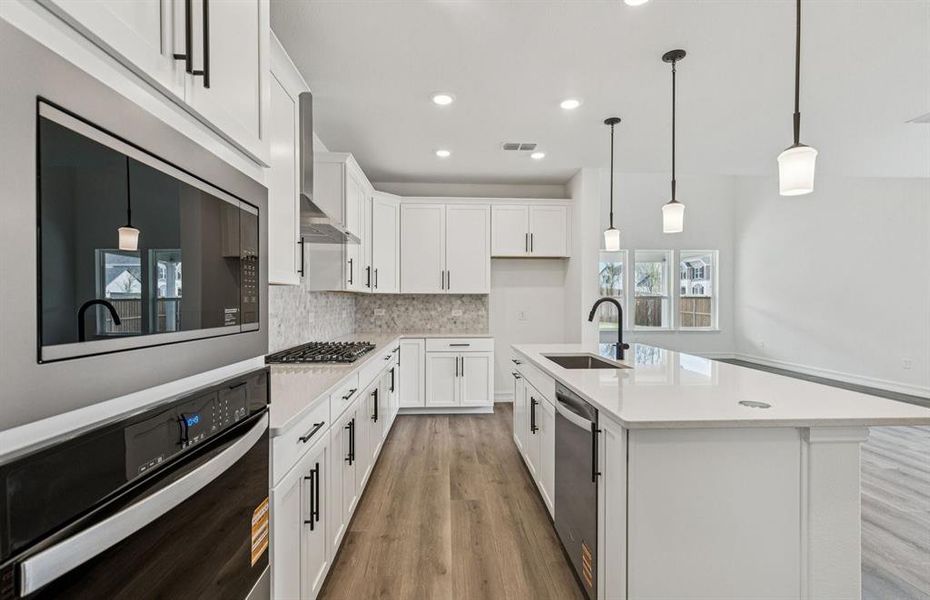 Spacious kitchen with eat-in bar top island Spacious kitchen with eat-in bar top island