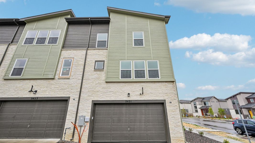 Front exterior of a new home in Windler Townhomes, Aurora, CO, highlighting curb appeal (Image 23). Front exterior of a new home in Windler Townhomes, Aurora, CO, highlighting curb appeal (Image 23).