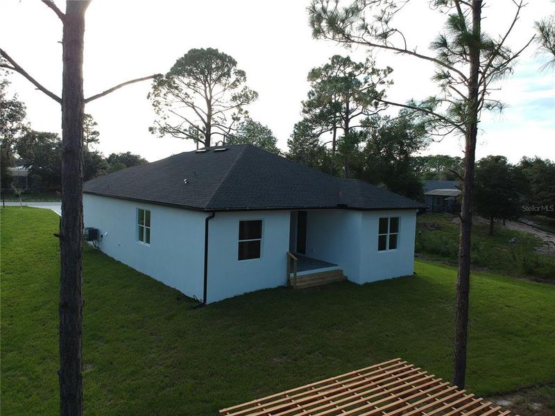 Front exterior of a new home in , Deltona, FL, highlighting curb appeal (Image 27). Front exterior of a new home in , Deltona, FL, highlighting curb appeal (Image 27).