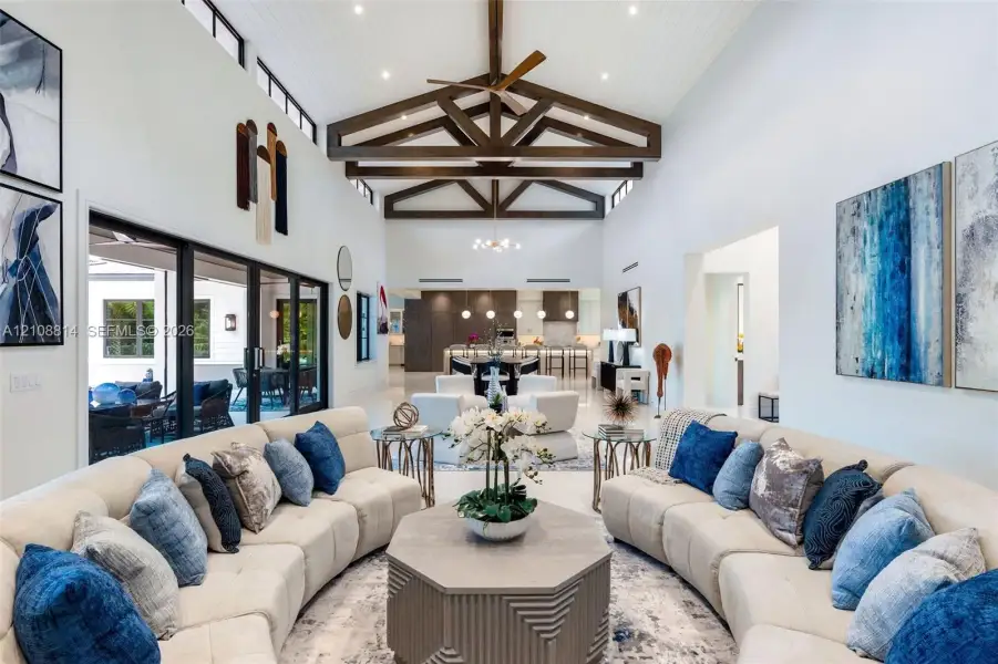 Vaulted ceilings with exposed decorative timber trusses and beadboard paneling, clerestory windows, and large-format tile flooring Vaulted ceilings with exposed decorative timber trusses and beadboard paneling, clerestory windows, and large-format tile flooring
