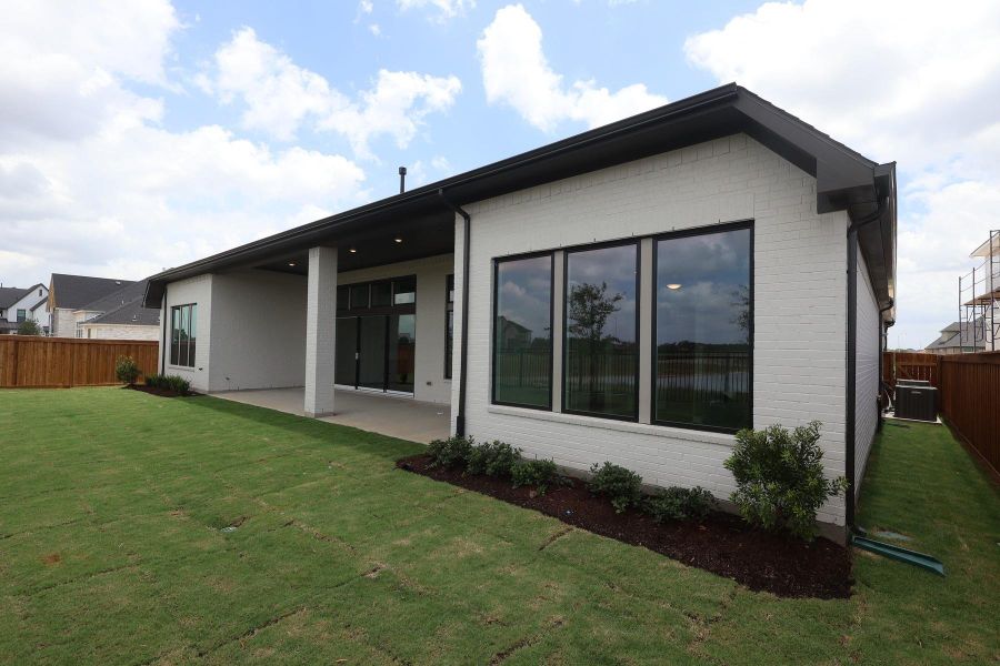 Exterior details and patio area of a home in Dunham Pointe, Cypress (Image 18). Exterior details and patio area of a home in Dunham Pointe, Cypress (Image 18).