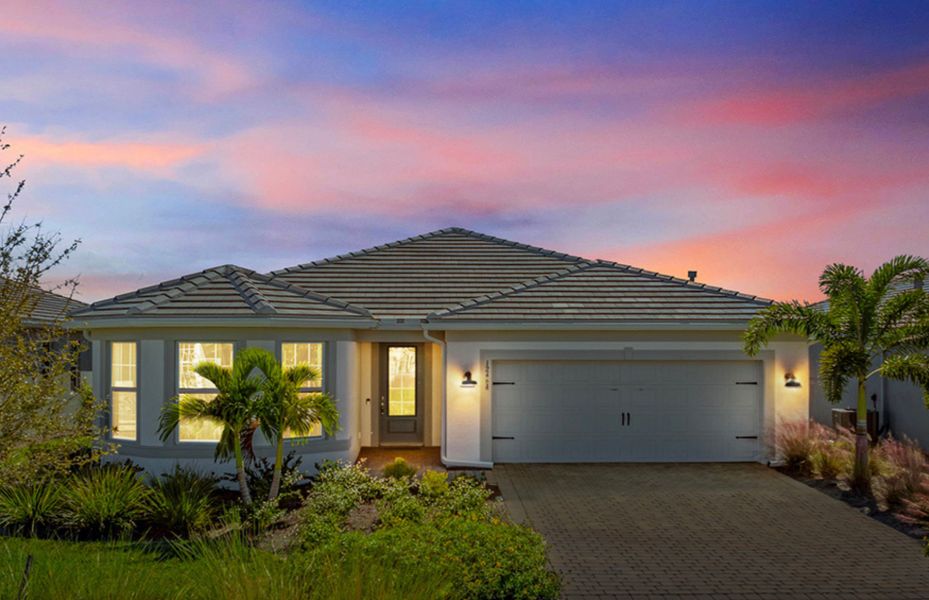 Front exterior of a new home in TerraWalk at Babcock Ranch, Alva, FL, highlighting curb appeal (Image 2).