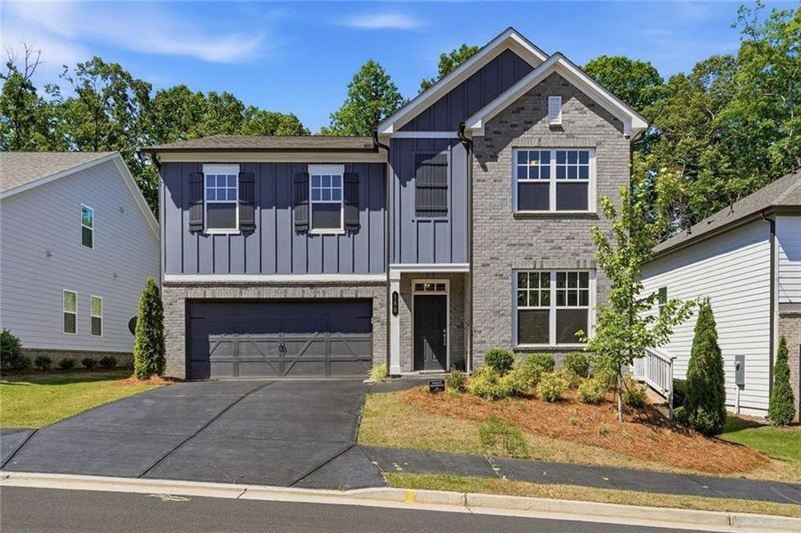 Front exterior of a new home in Creekside, Dawsonville, GA, highlighting curb appeal (Image 1). Front exterior of a new home in Creekside, Dawsonville, GA, highlighting curb appeal (Image 1).